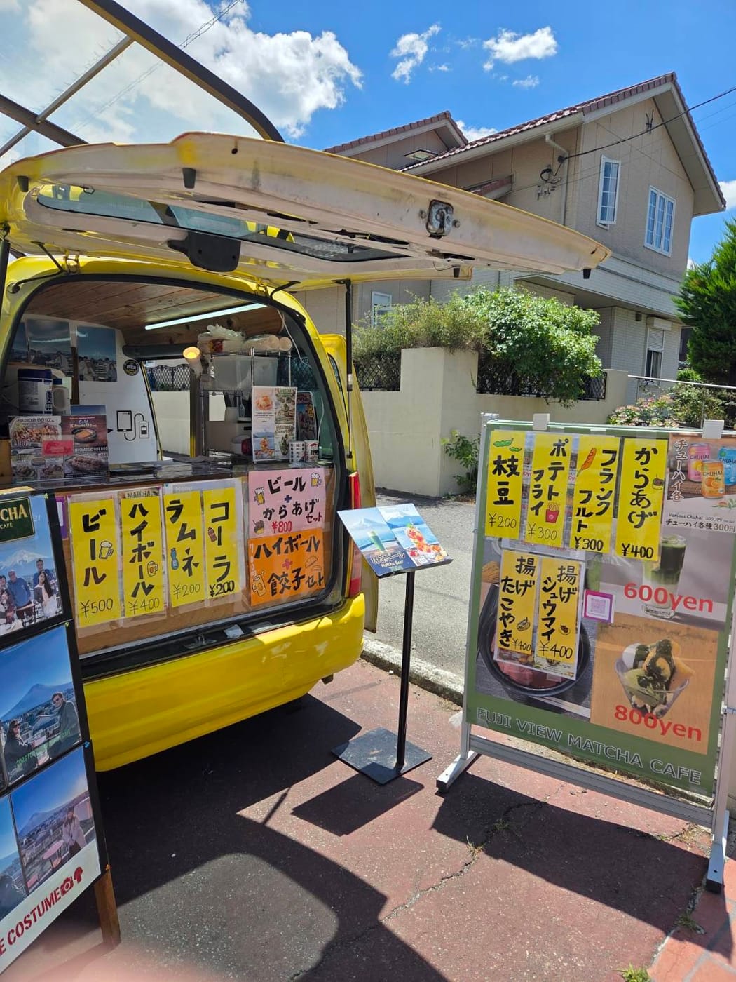 Yellow kitchen car serving drinks and festival snacks at the rooftop matcha café