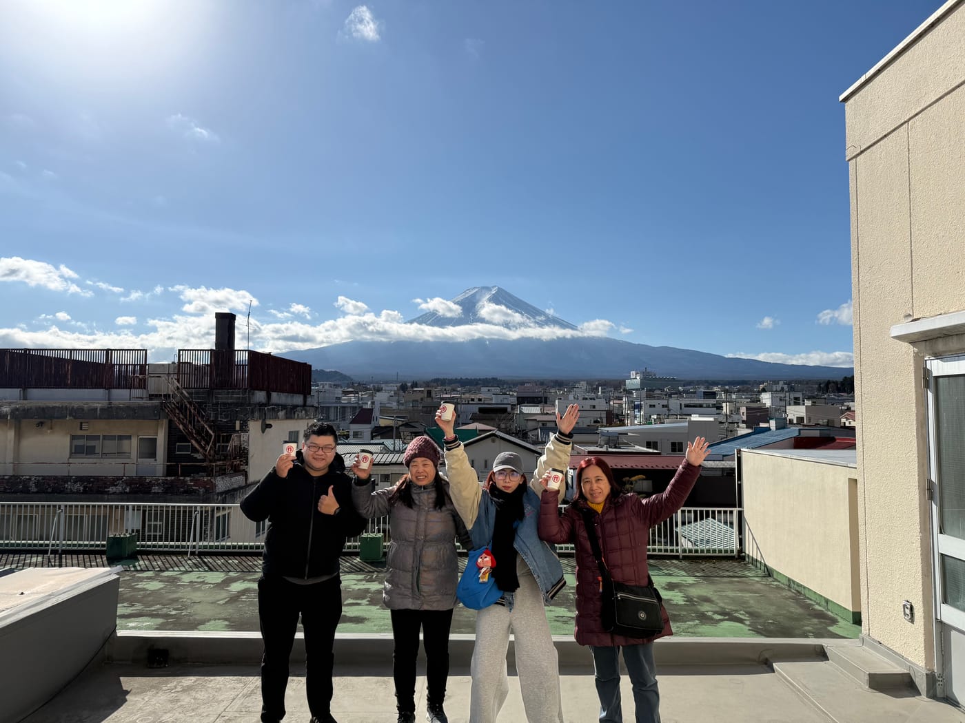 Guests cheering on the rooftop with Mt. Fuji