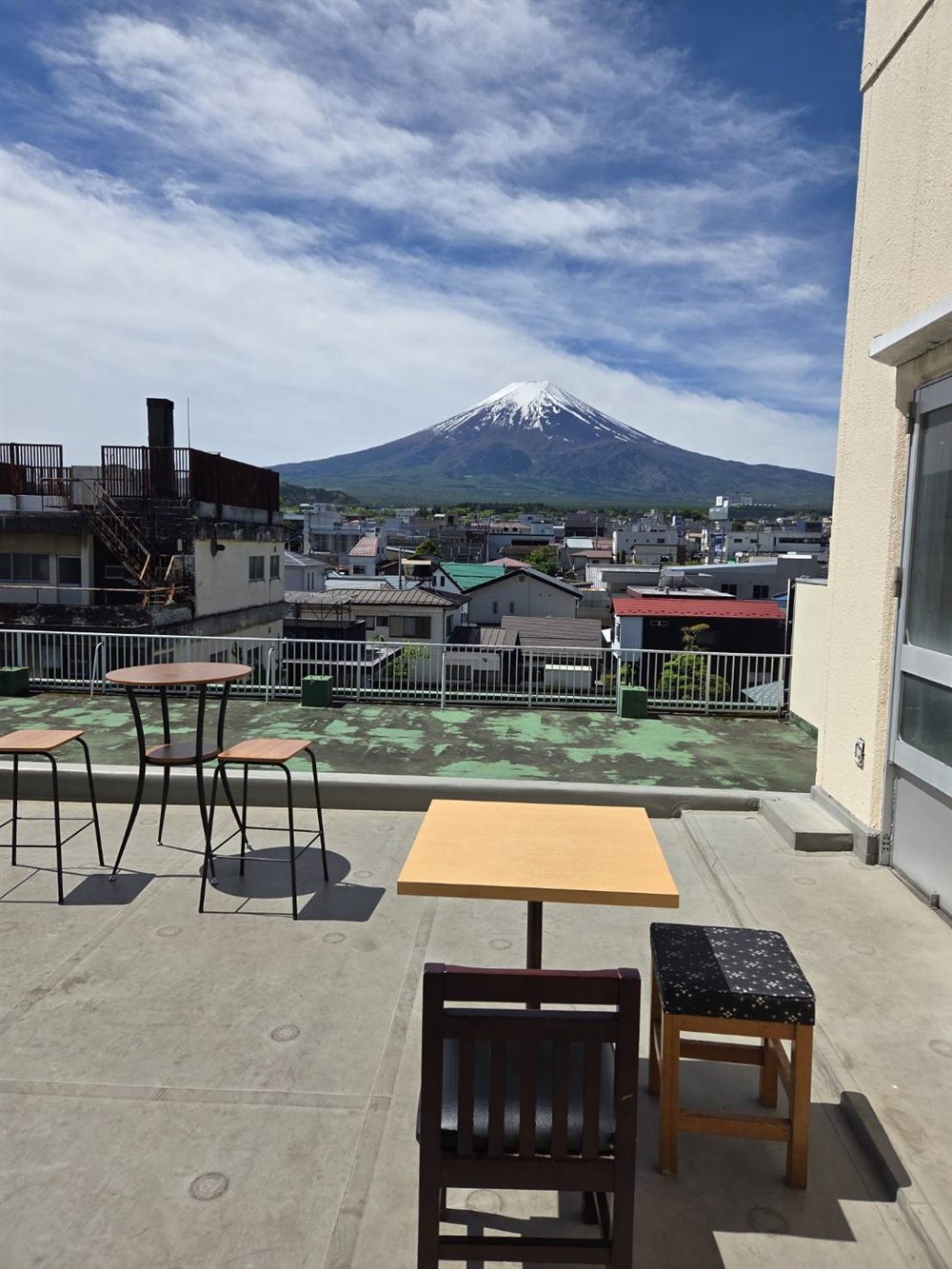 Rooftop terrace seating with Mt. Fuji beyond Fujiyoshida