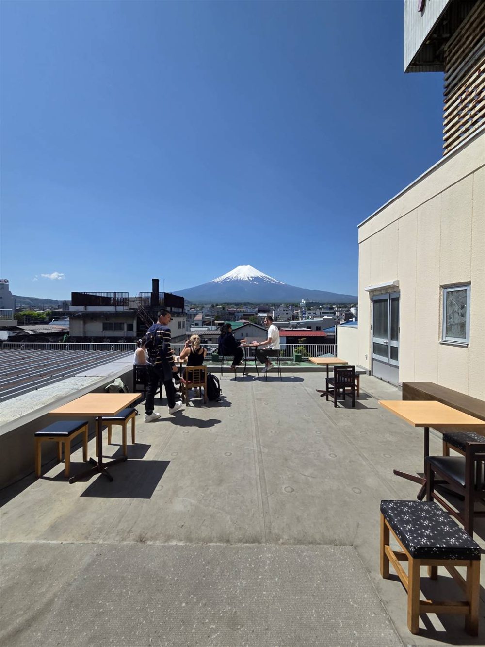 Guests enjoying the rooftop café with a clear Mt. Fuji view